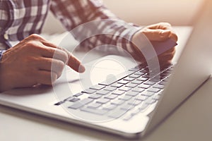 Man using touchpad on notebook