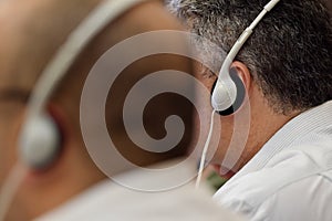 Man using translation headphones