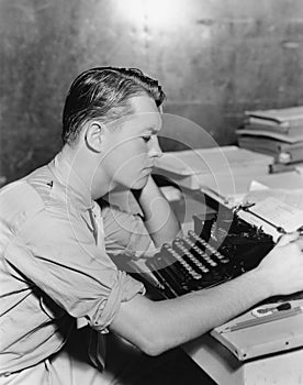 Man using typewriter