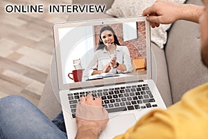 Man using video chat for online job interview, closeup