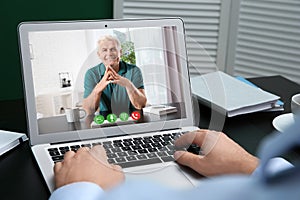 Man using video chat for online job interview, closeup