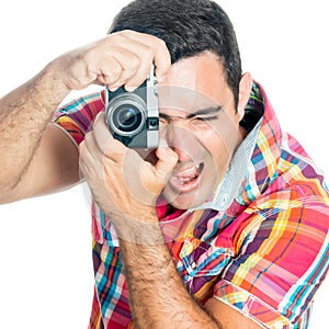 Man using a vintage looking compact camera