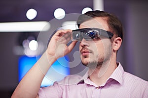 Man using virtual reality gadget computer glasses