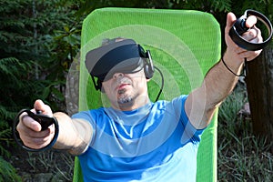 Man using the virtual reality headset enjoy a game