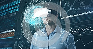 Man using virtual reality headset and futuristic screen