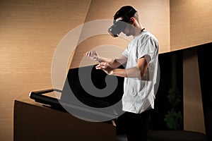 Man using a VR headset with motion tracking tech, make hand gestures in the air