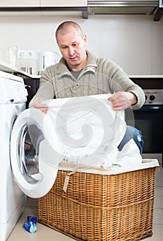 Man using washing machine