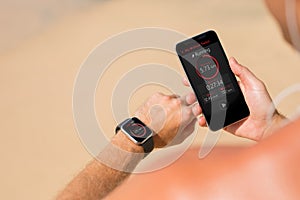 Man using wearable tech during fitness workout photo
