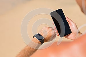 Man using wearable tech during workout