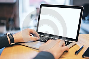 Man using white laptop screen on desktop