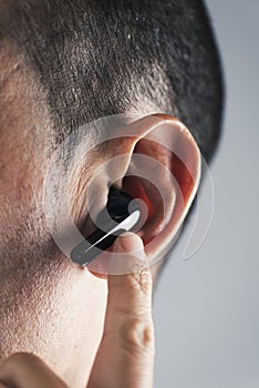 Man using wireless earphones