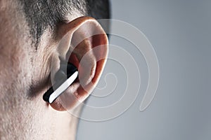 Man using wireless earphones