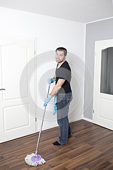 Man vacuums flat