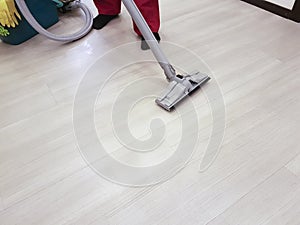 The man vacuums the floor cleaning equipment scene