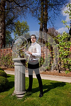 Man in Victorian clothing, shaft and sundial in th