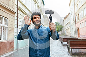 Man Video Blogging On Camera On Street, Taking Photos