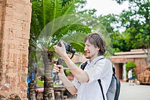 Man videographer shoots video in the electronic stabilizer, steadycam To shoot at Po Nagar Cham Tovers. Digital photo