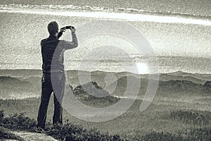 Man on view place on mountain  in Saechsische Schweiz