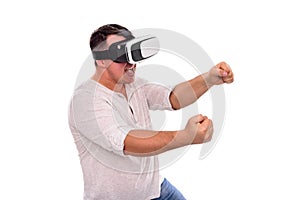 A man in virtual reality glasses is driving an invisible car playing a game or a simulator.