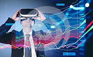 Man in virtual reality glasses, graphs rising and falling, doubl