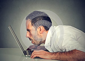 Man with vision problems using computer reading email browsing internet