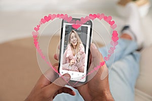 Man visiting dating site via smartphone indoors, closeup