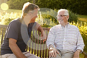 Man Visiting Senior Male Relative In Assisted Living Facility