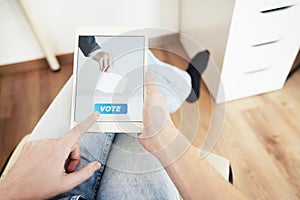 Man Voting Online Sitting at Home