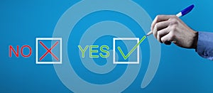 Man voting yes check box. Positive decision