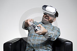 Man in vr glasses impressed by a game