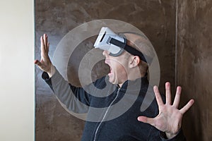 Man with VR glasses terrified