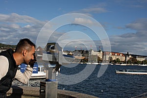 Man waching a landmarks od Zurich in Swiss.