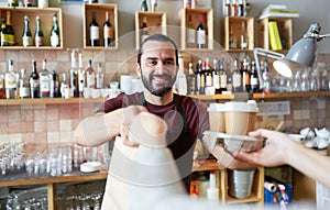 Man or waiter serving customer at coffee shop