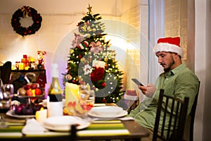 Man waiting for friends to come to Christmas party