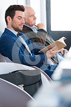 man waiting for interview indoors