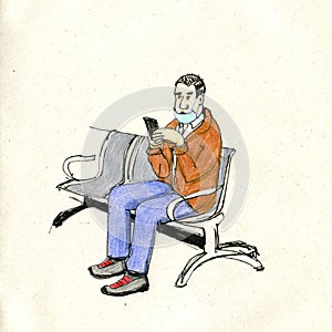 Man in the waiting room with his cell phone and misplaced mask