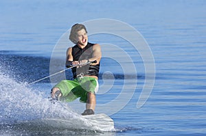 Man Wakeboarding On Lake