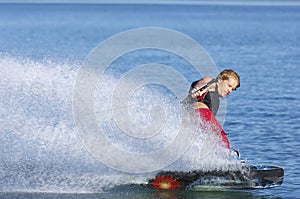 Man Wakeboarding On Lake