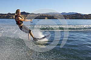 Man Wakeboarding On Lake