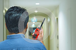 Man with a Walkie Talkie or Portable radio transceiver