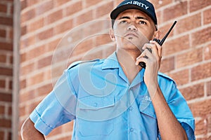 Man, walkie talkie and security guard in city in conversation, communication or surveillance. Safety, report and serious