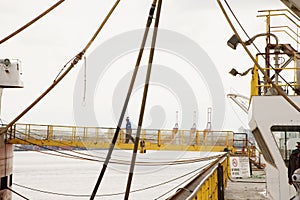 Man Walking Across Gangway