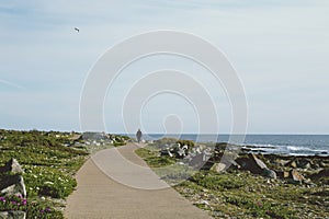 Man walking alone by the sea