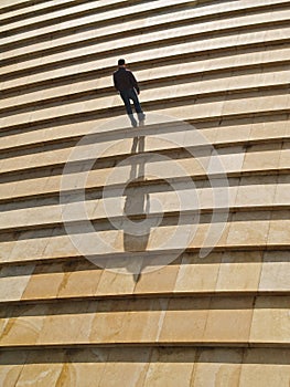 Man walking alone upstairs