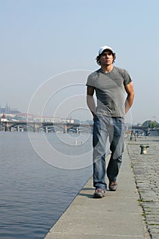 Man Walking Along the Embankment photo