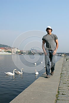 Man Walking Along the Embankment photo