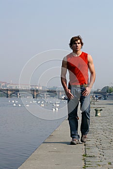 Man Walking Along the Embankment