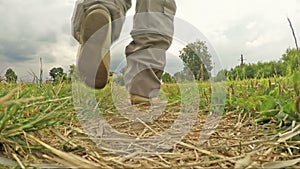 Man walking along a footpath in the countryside