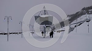 Man walking away on an empty desolate raod