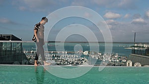 man walking on the background of the marina